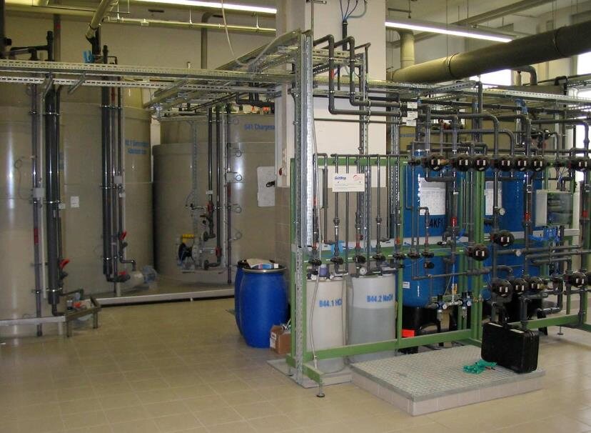 Process hall with tanks, skids and drums
